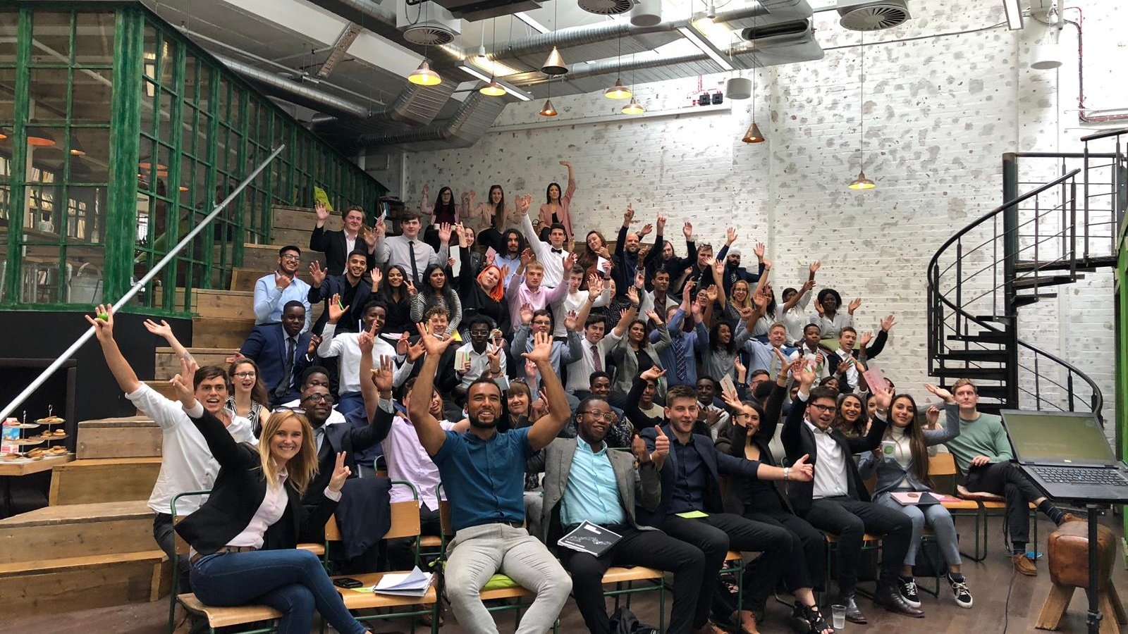Large team photo in event hall